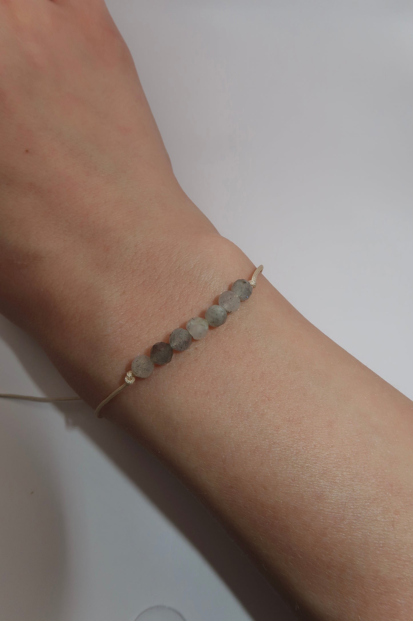 Grey string bracelet